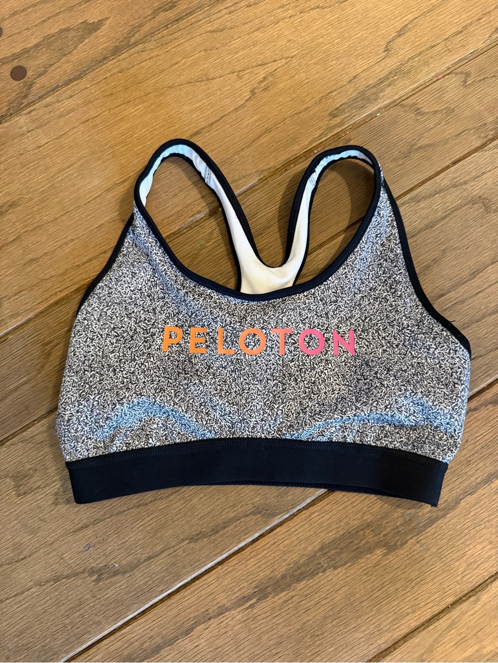 Peloton x Adidas Heathered Black Sports Bra with Pink-Orange Logo